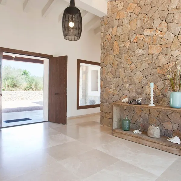 Entrance hall with a natural stone wall