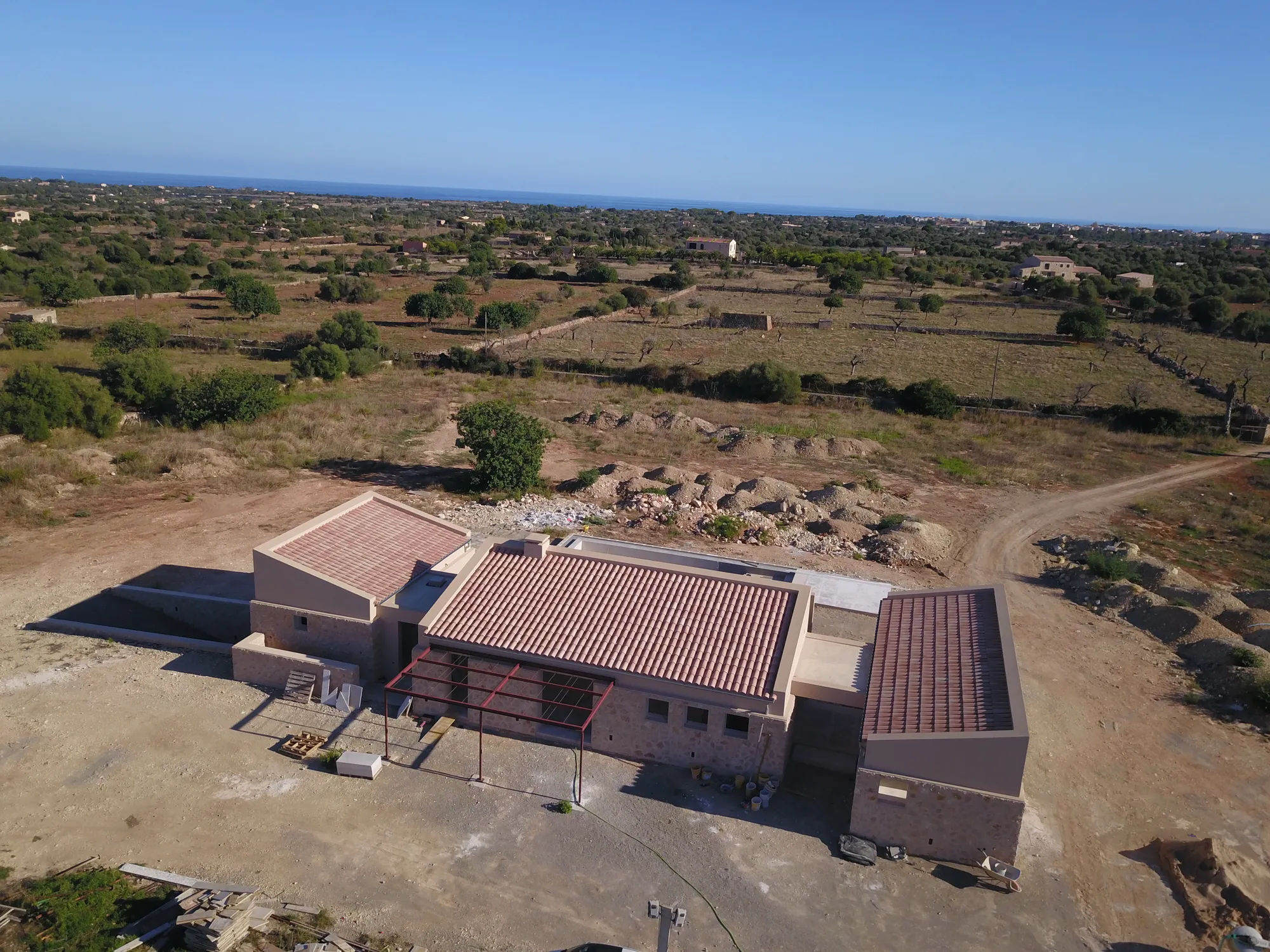 A new country house under construction on rural land in Mallorca, seen from the air